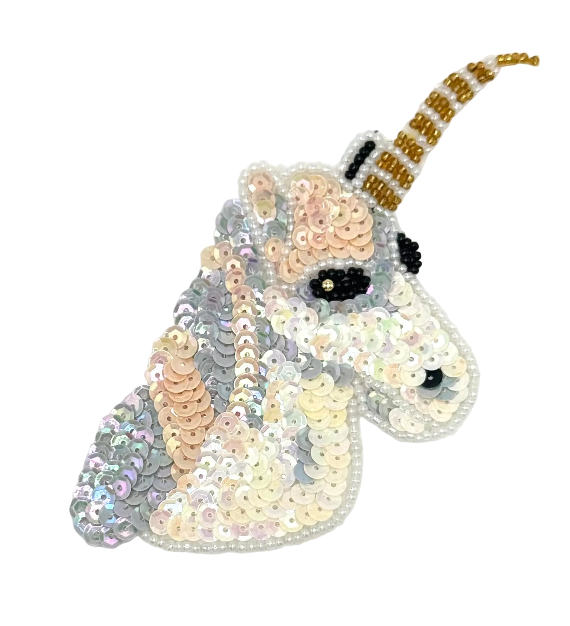 Sequined unicorn head with a white background