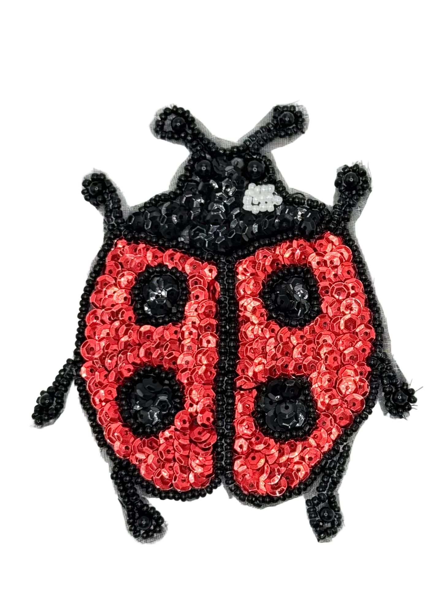 Sequined ladybug design on a white background