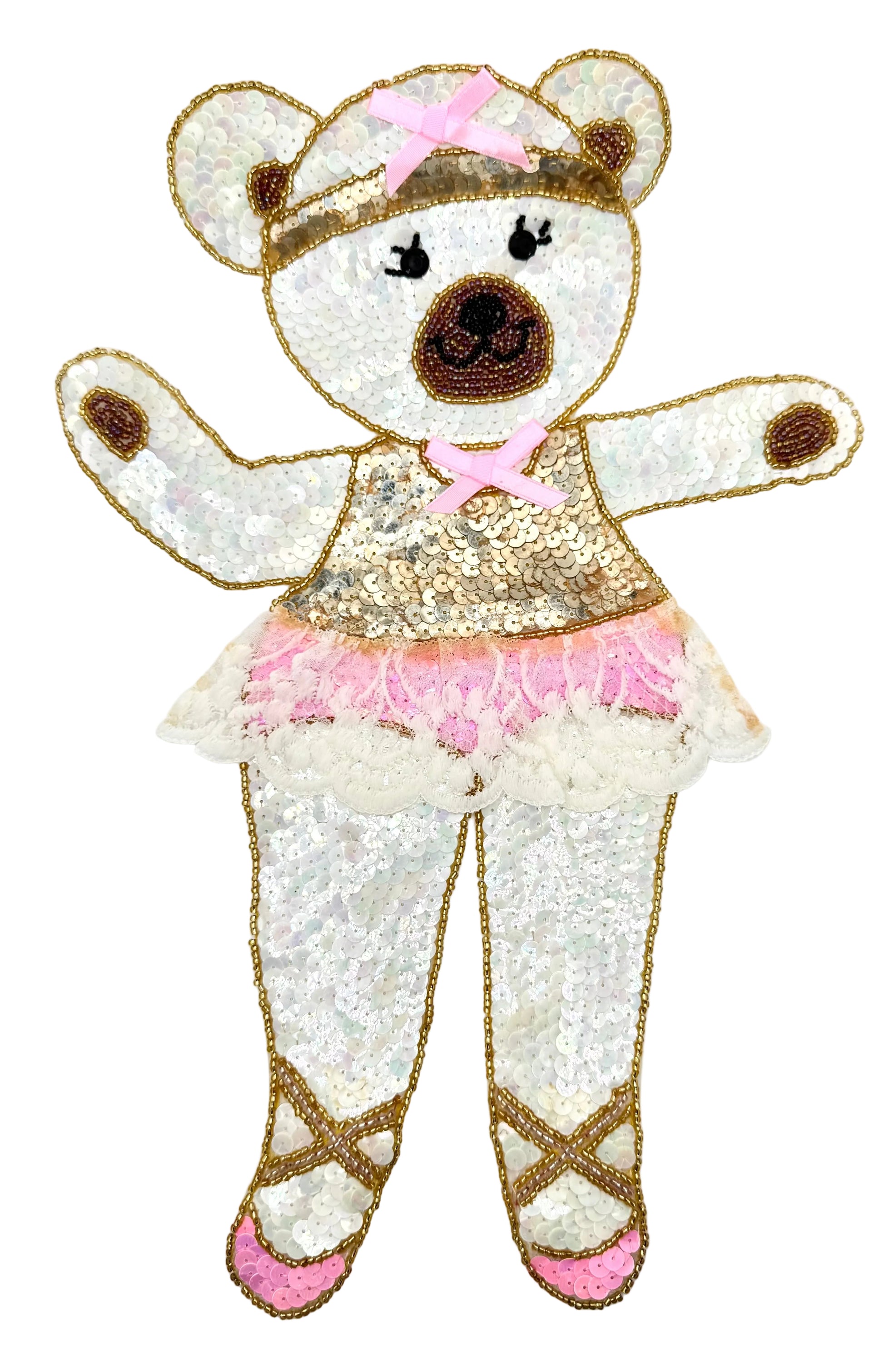 Sequined bear in a ballet outfit with pink shoes on a white background
