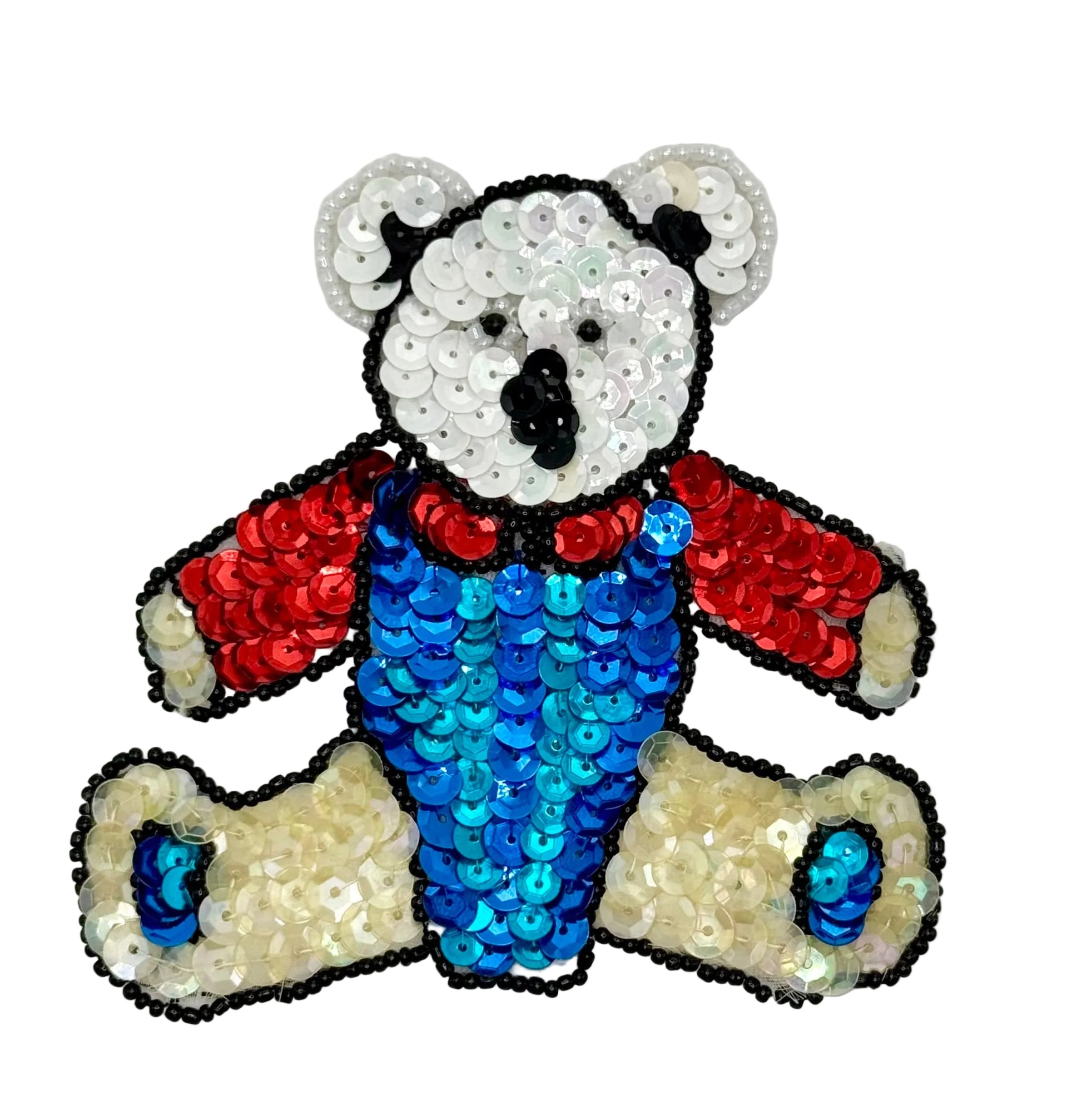 Sequined teddy bear with red and blue details on a white background