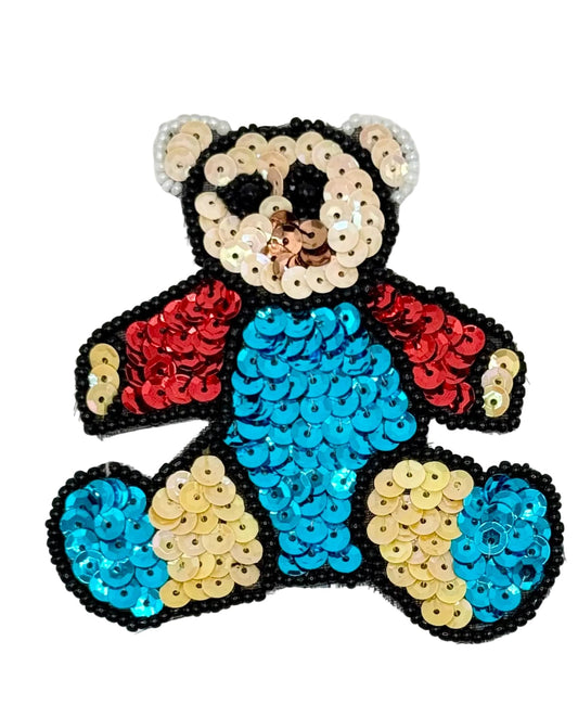Sequined teddy bear patch on a white background