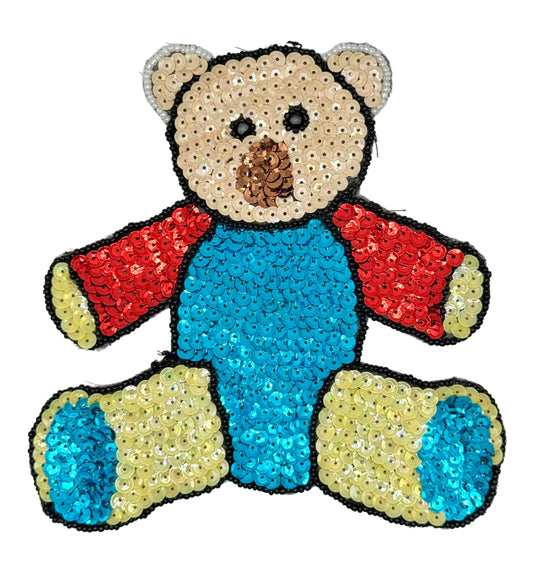 Sequined teddy bear patch with red, blue and yellow sequins on a white background