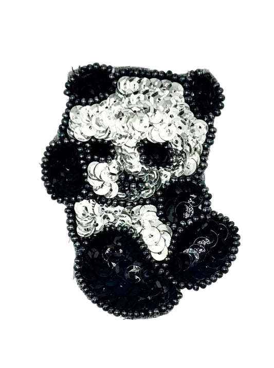 Black and white beaded baby panda on a white background