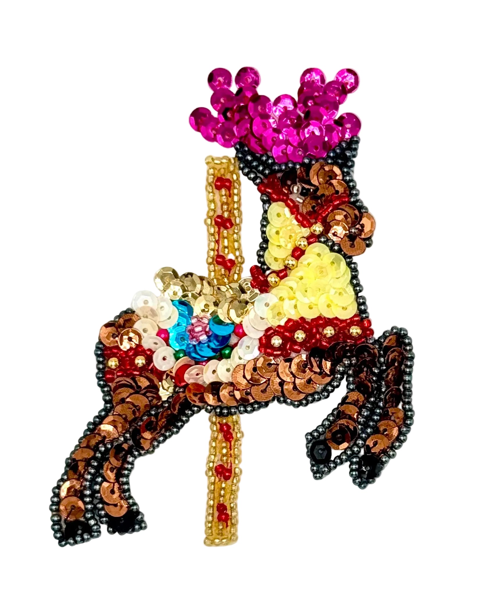 Decorative carousel reindeer with sequins and beads on a white background 