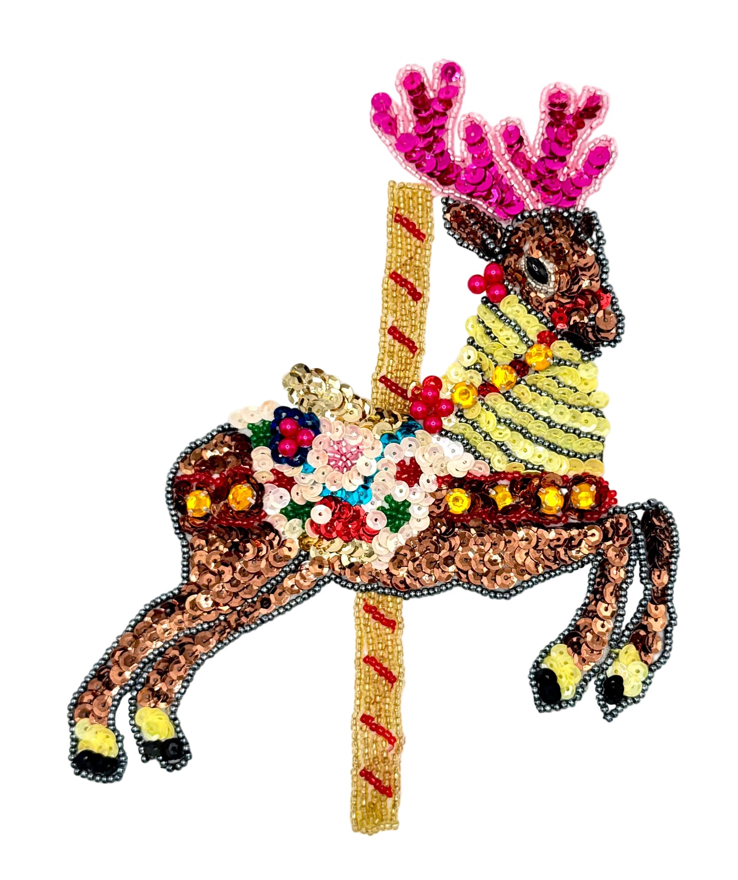 Decorative carousel reindeer with sequins and beads on a white background 