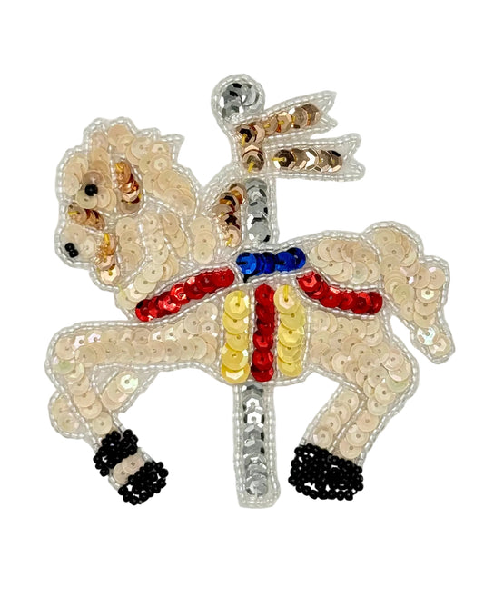 Sequined carousel  horse with sequins and beads on a white background