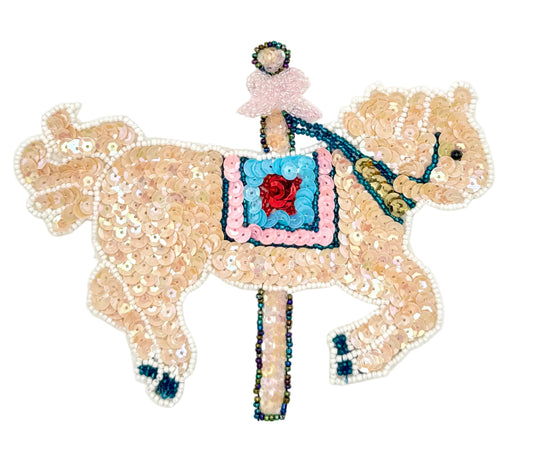 Sequined carousel horse with sequins and beads on a white background