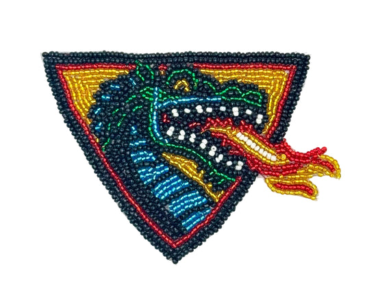 Fire breathing dragon patch with beaded design on a white background