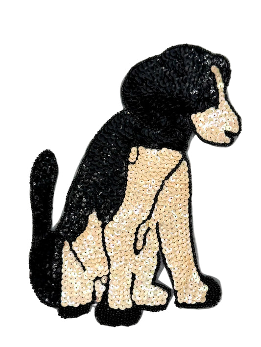Sequined dog patch on a white background