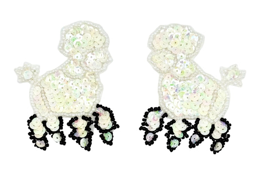 Pair of white iridescent poodle patches with sequin details on a white background