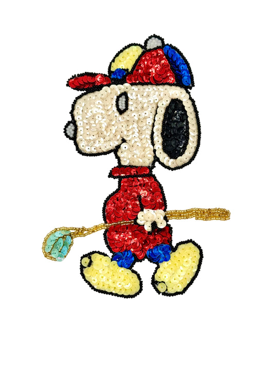 Vintage Sequined Snoopy character holding a golf club on a white background