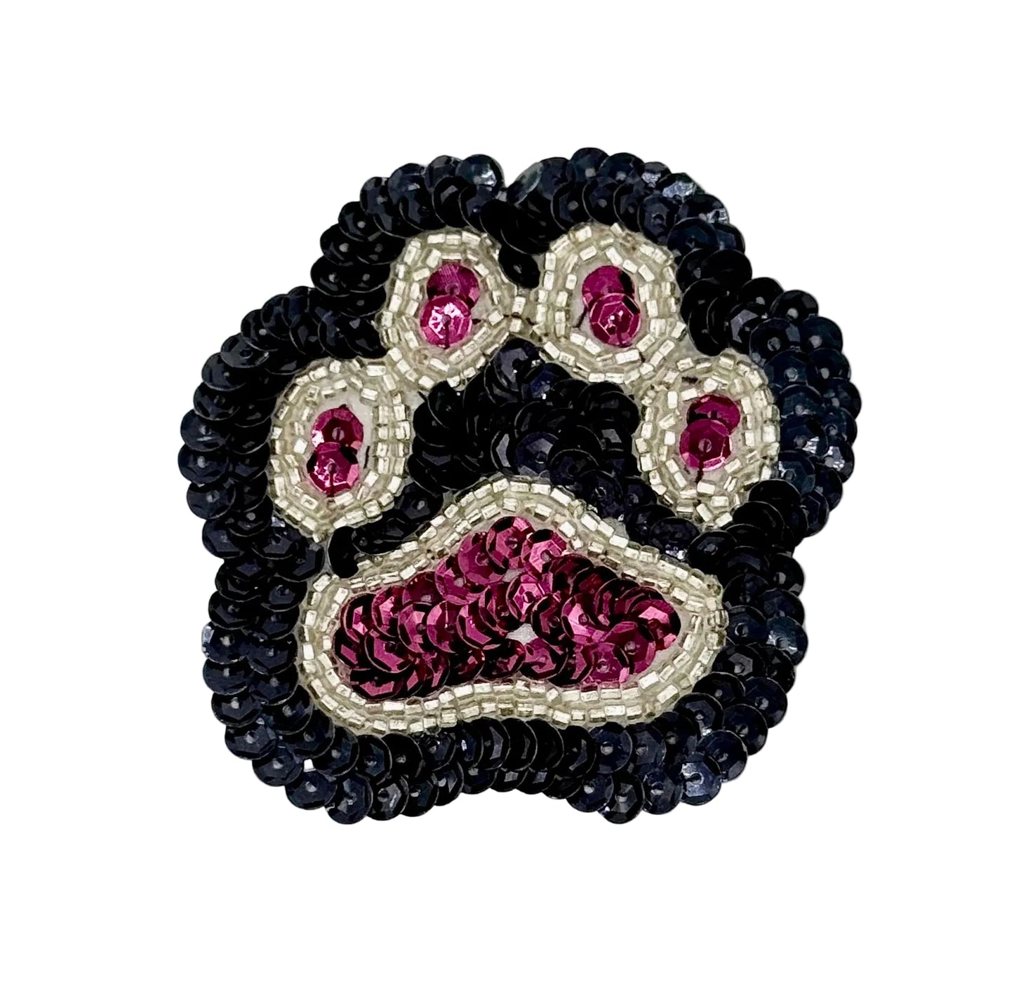 Paw print patch with  black, burgandy, and silver sequins and beads on a white background.