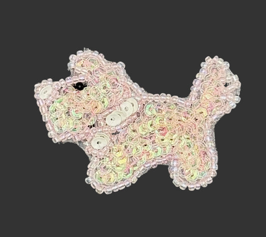 Sequined scottie dog patch on a gray background