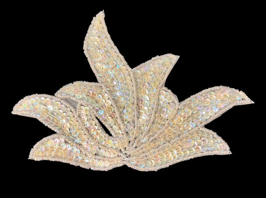 Decorative leaf-shaped embellishment with sequins on a dark background