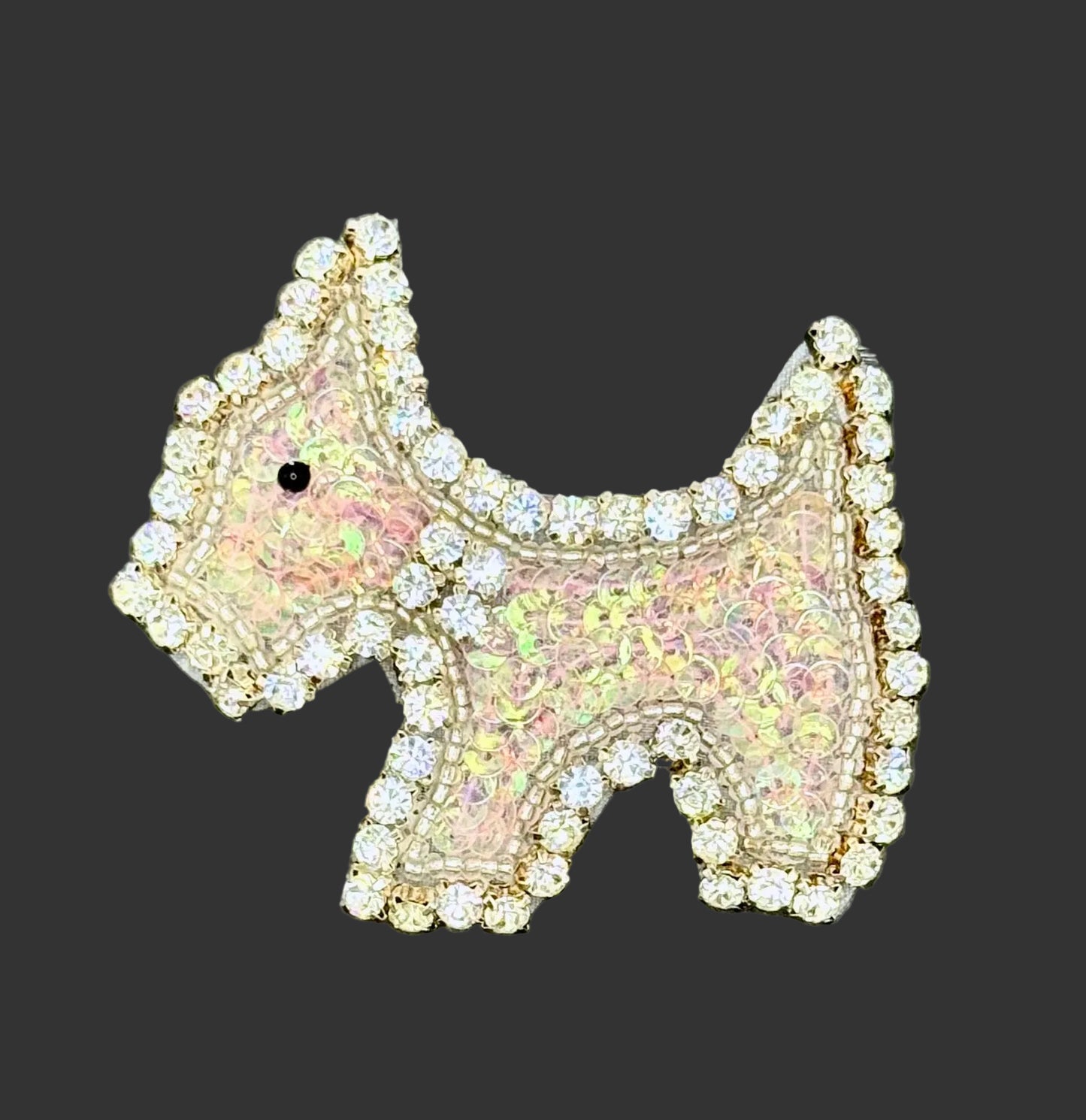 Iridescent Pink Sequin Scottie Dog Patch with rhinestone detailing on a black background