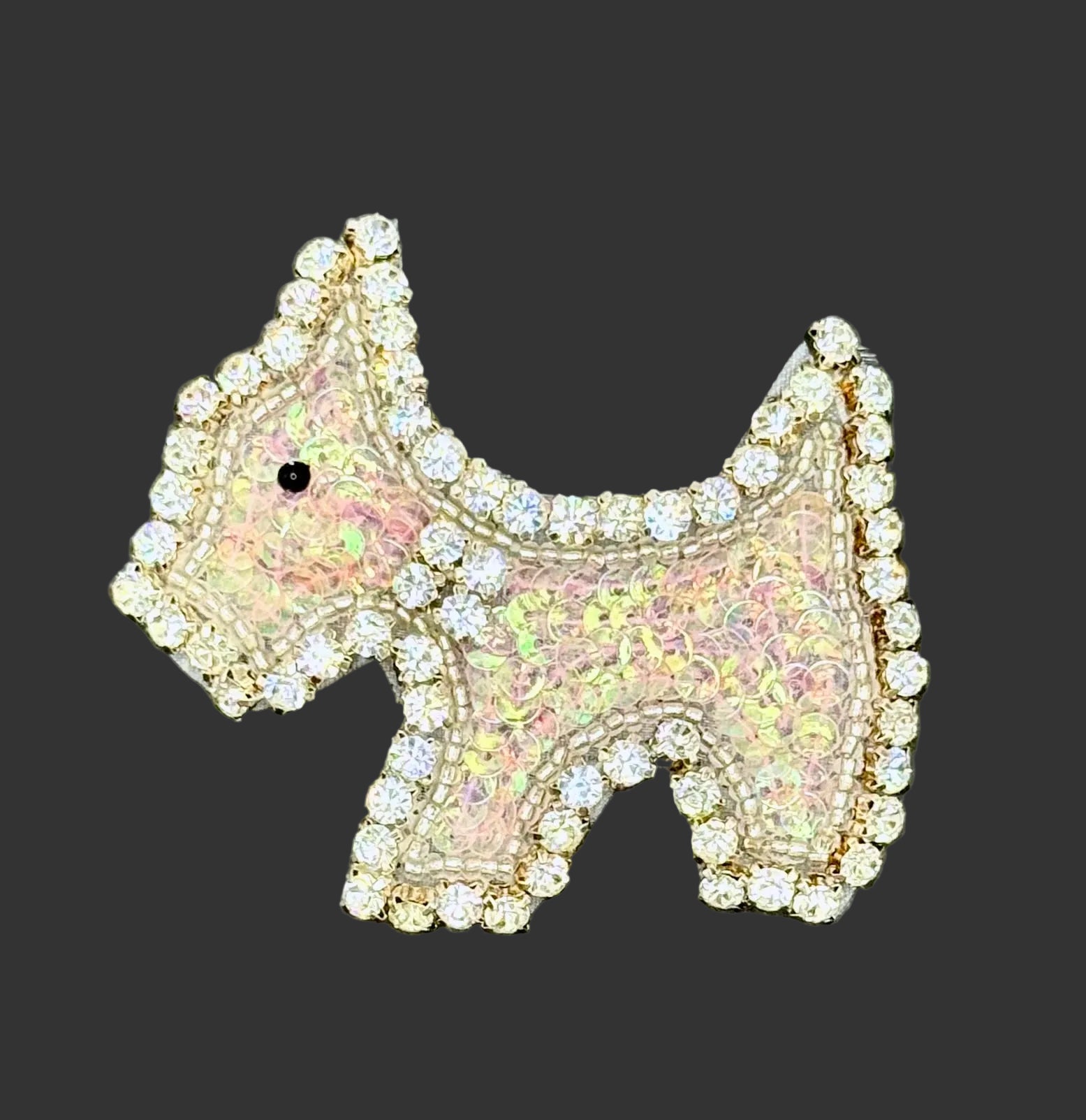 Iridescent Pink Sequin Scottie Dog Patch with rhinestone detailing on a black background