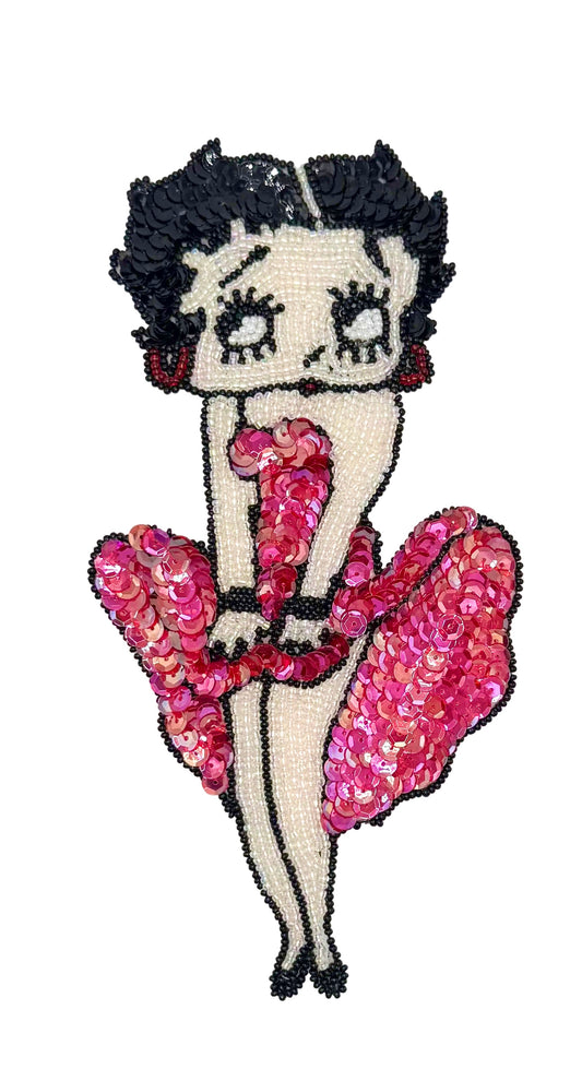 Vintage Sequin patch of a character in a pink dress on a white background