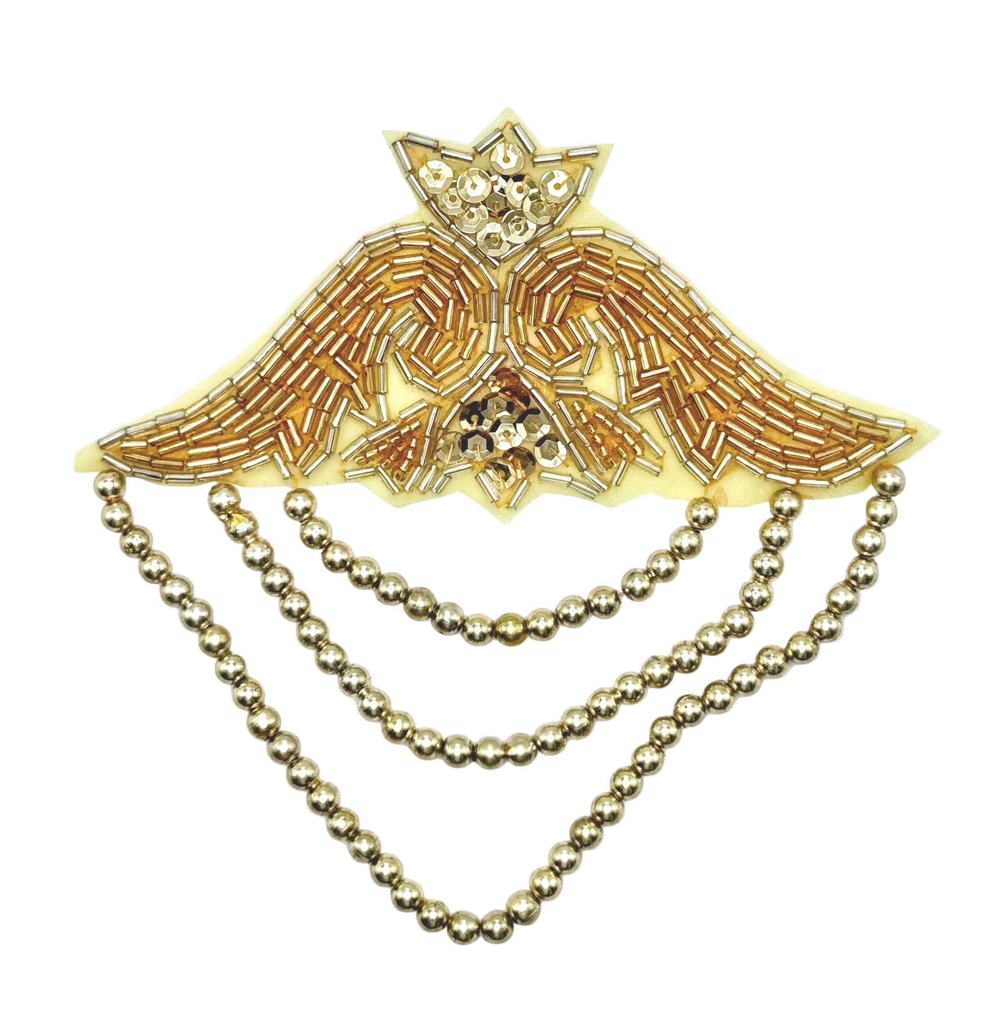 Decorative gold and silver epaulet with sequins and beads on a white background