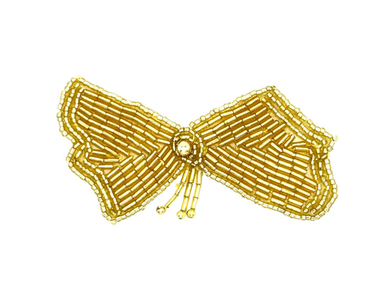 Gold beaded bow on a white background