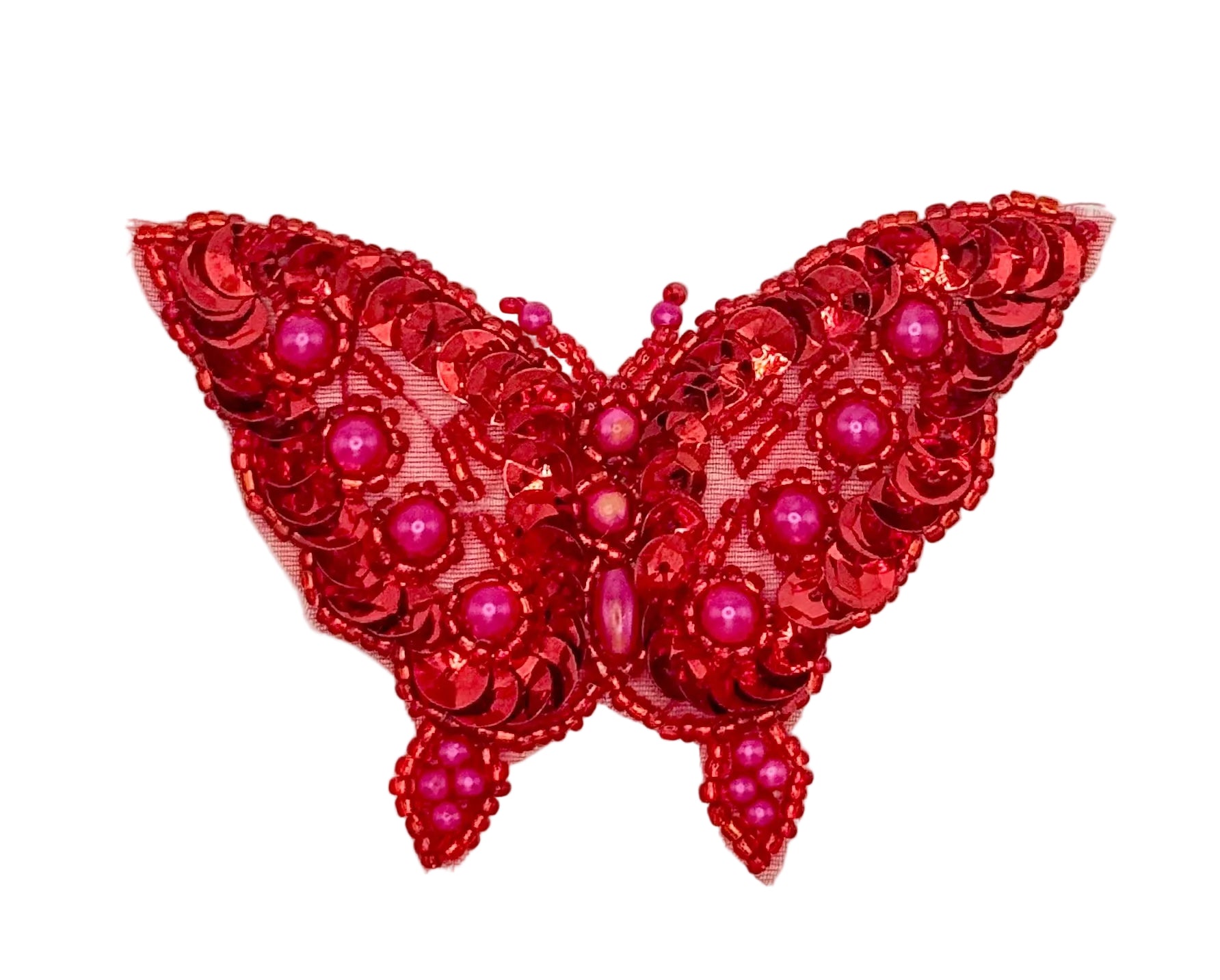 Red butterfly-shaped decorative item with sequins and beads on a white background