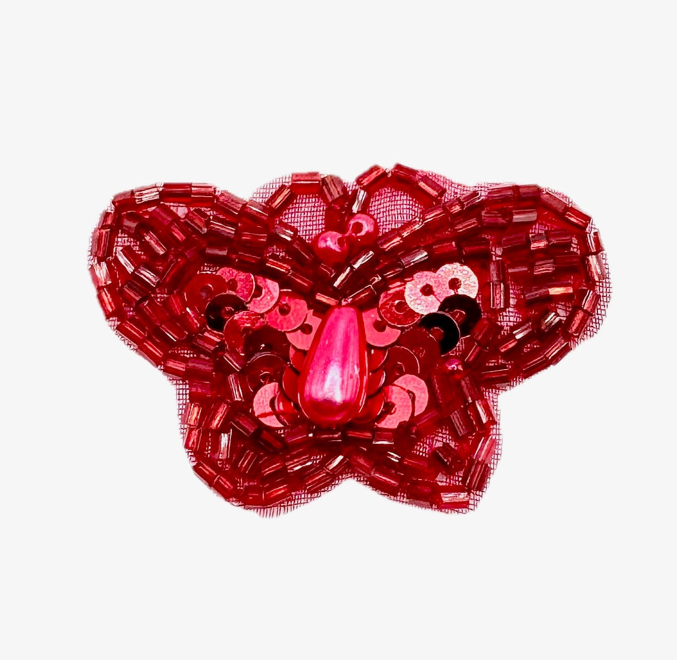 Red butterfly-shaped decorative item with sequins on a white background