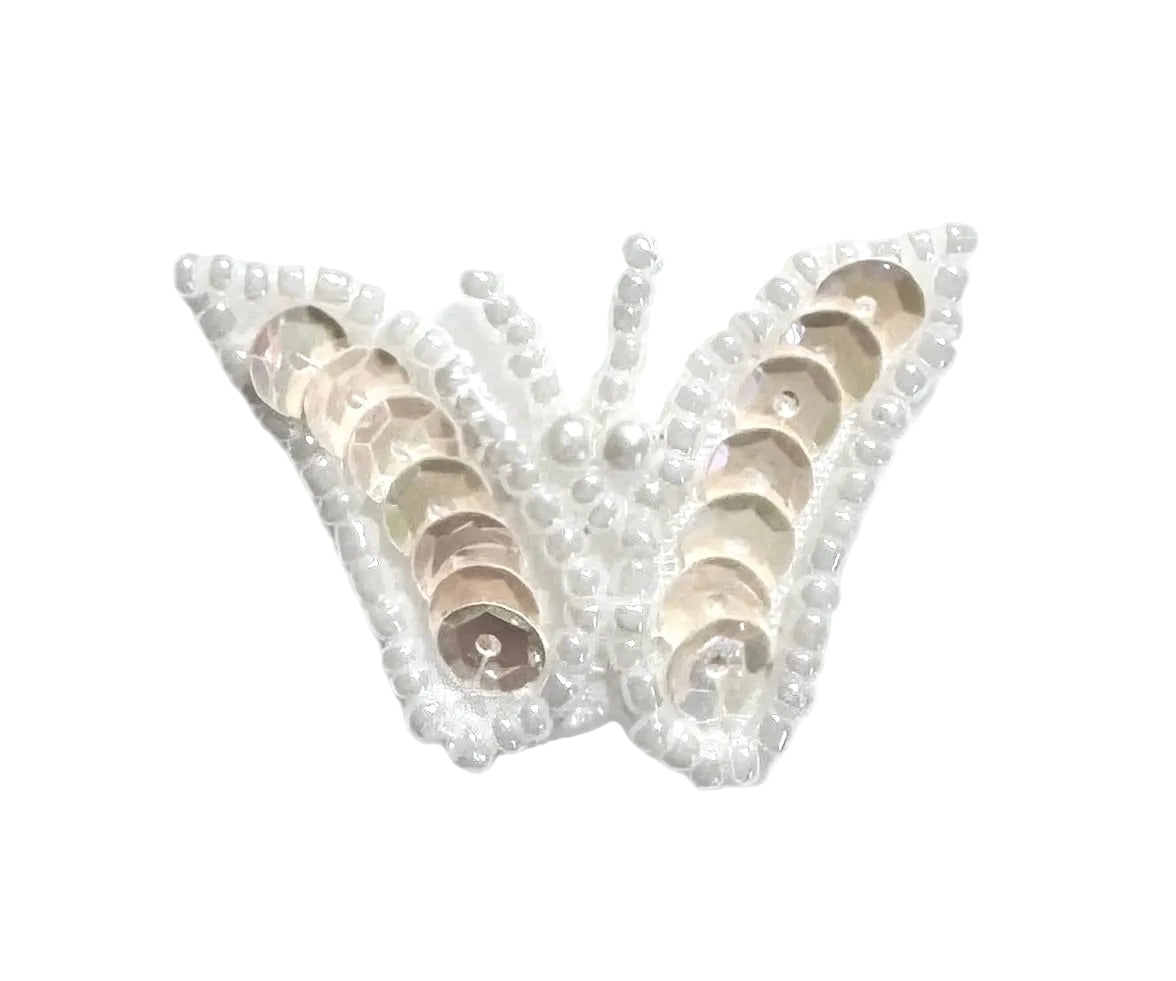 Iridescent White sequin butterfly with white beads on a white background
