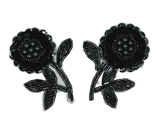 Pair of black floral sequin patches on a white background