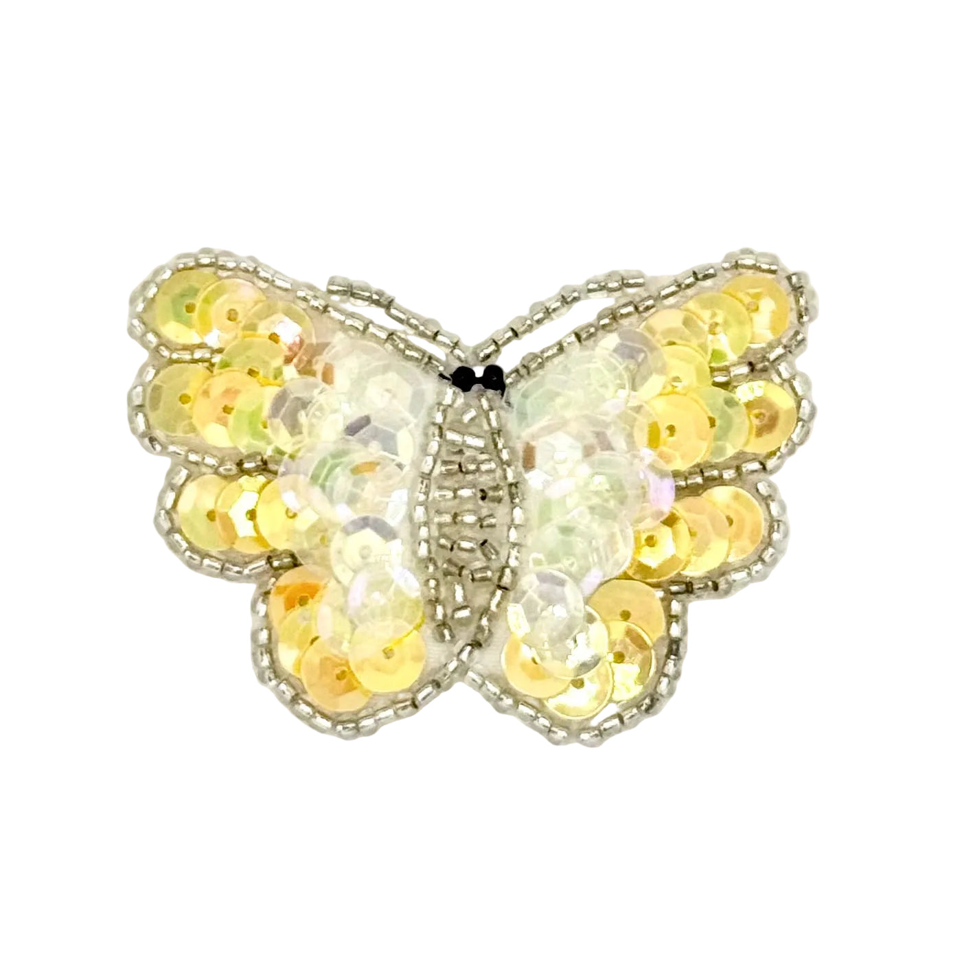 Butterfly-shaped decorative item with yellow sequins on a white background