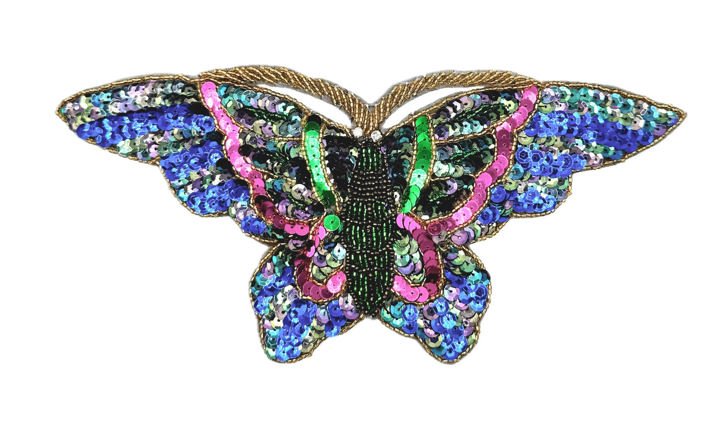 Multicolored butterfly-shaped patch with sequins and beads on a white background
