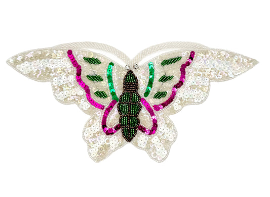 Butterfly-shaped decorative item with sequins and beads on a white background