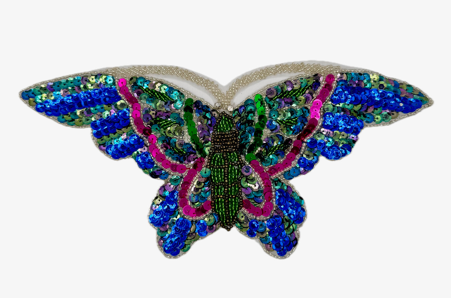 Colorful butterfly-shaped decorative item with sequins on a white background