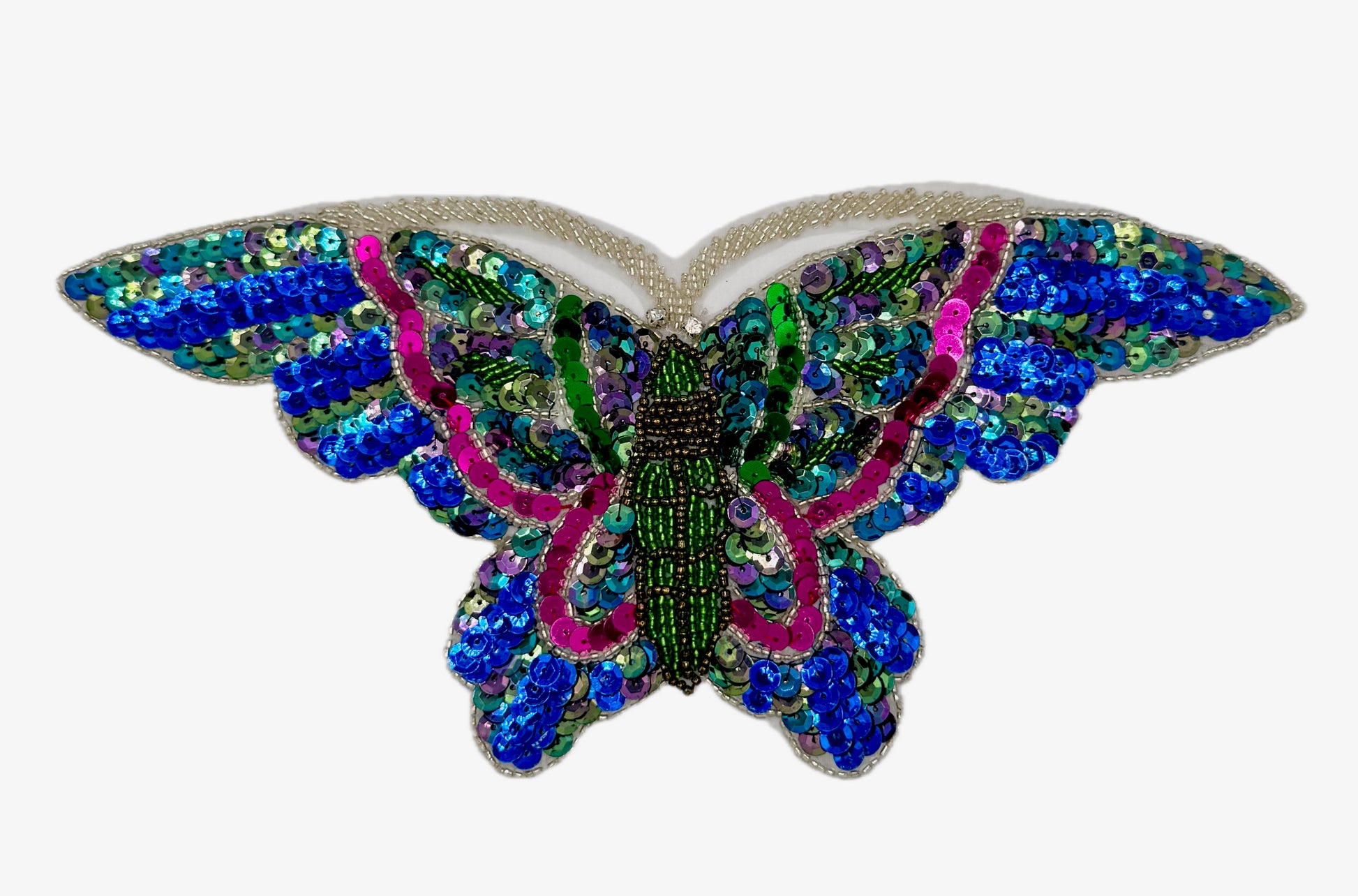 Colorful butterfly-shaped decorative item with sequins on a white background