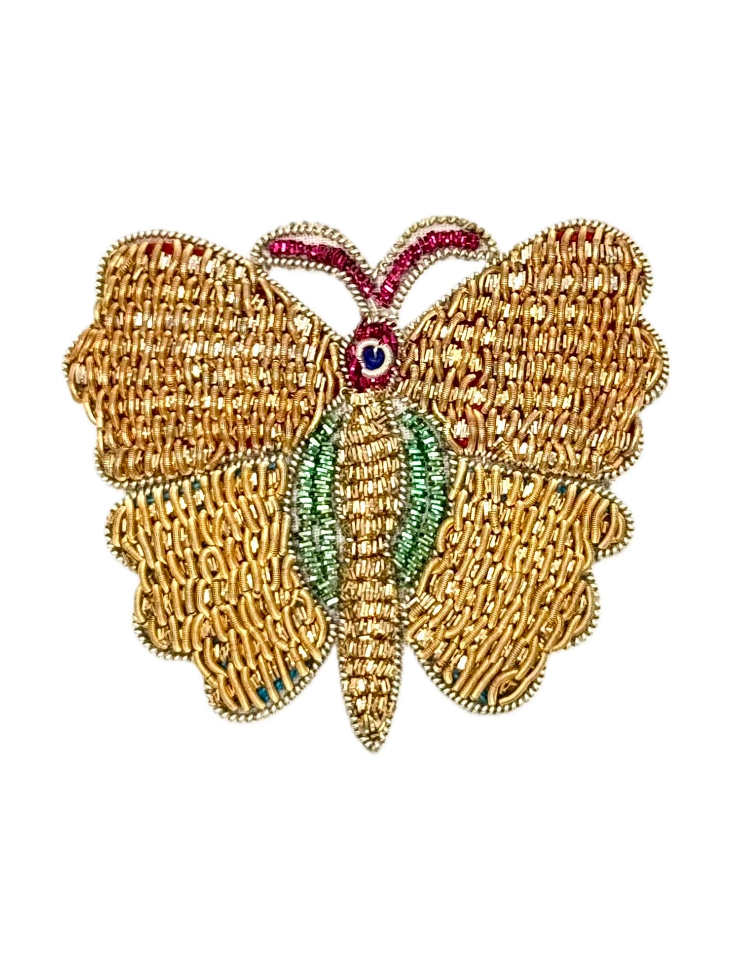 Gold butterfly patch with green and fuchsia details on a white background