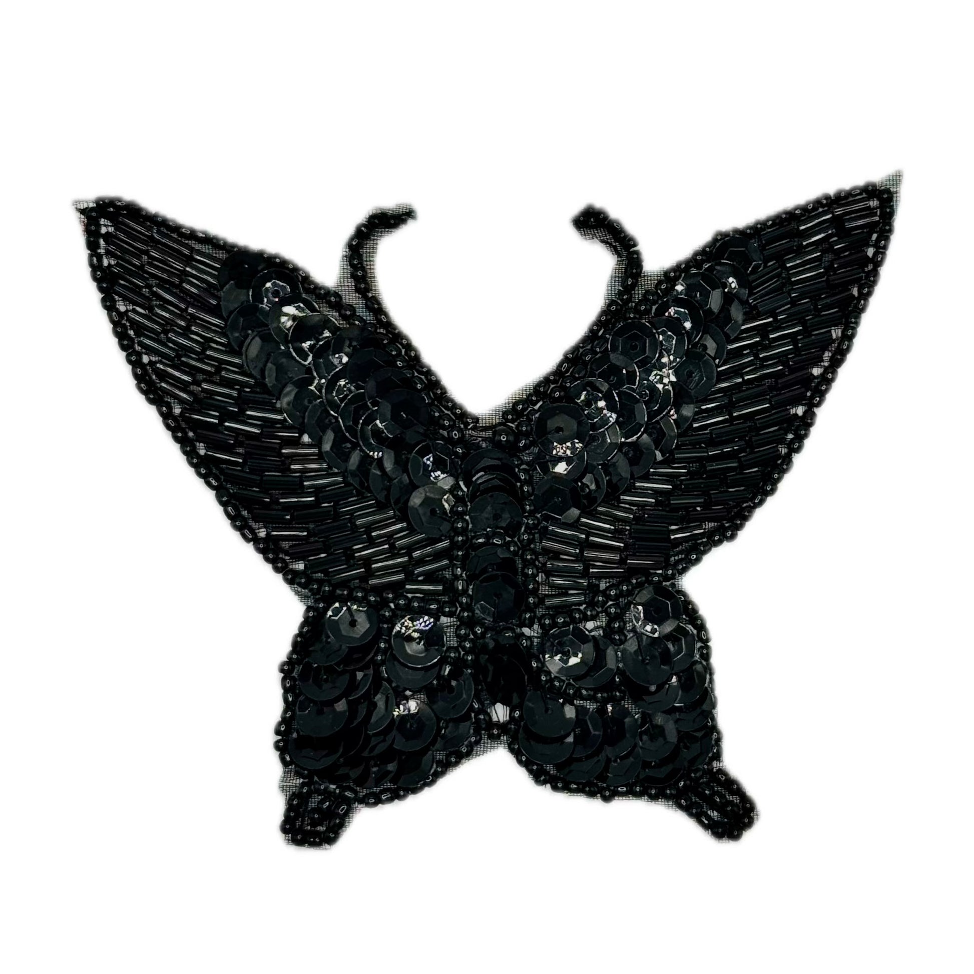 Black butterfly-shaped patch with sequins on a white background