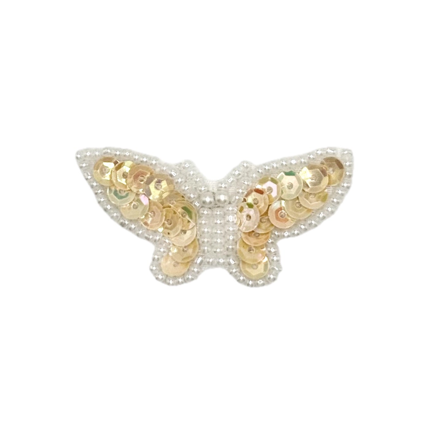 Butterfly-shaped patch with Iridescent Tan sequins on a white background