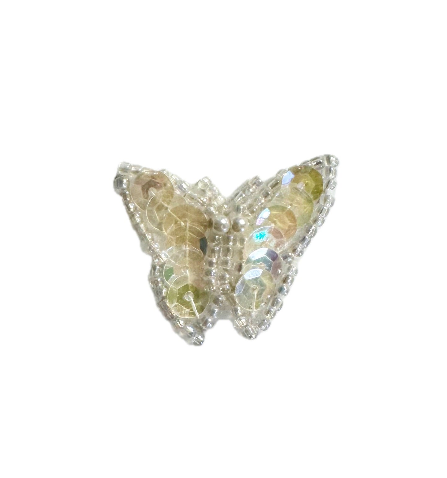 Butterfly-shaped patch with iridescent sequins and beads on a white background