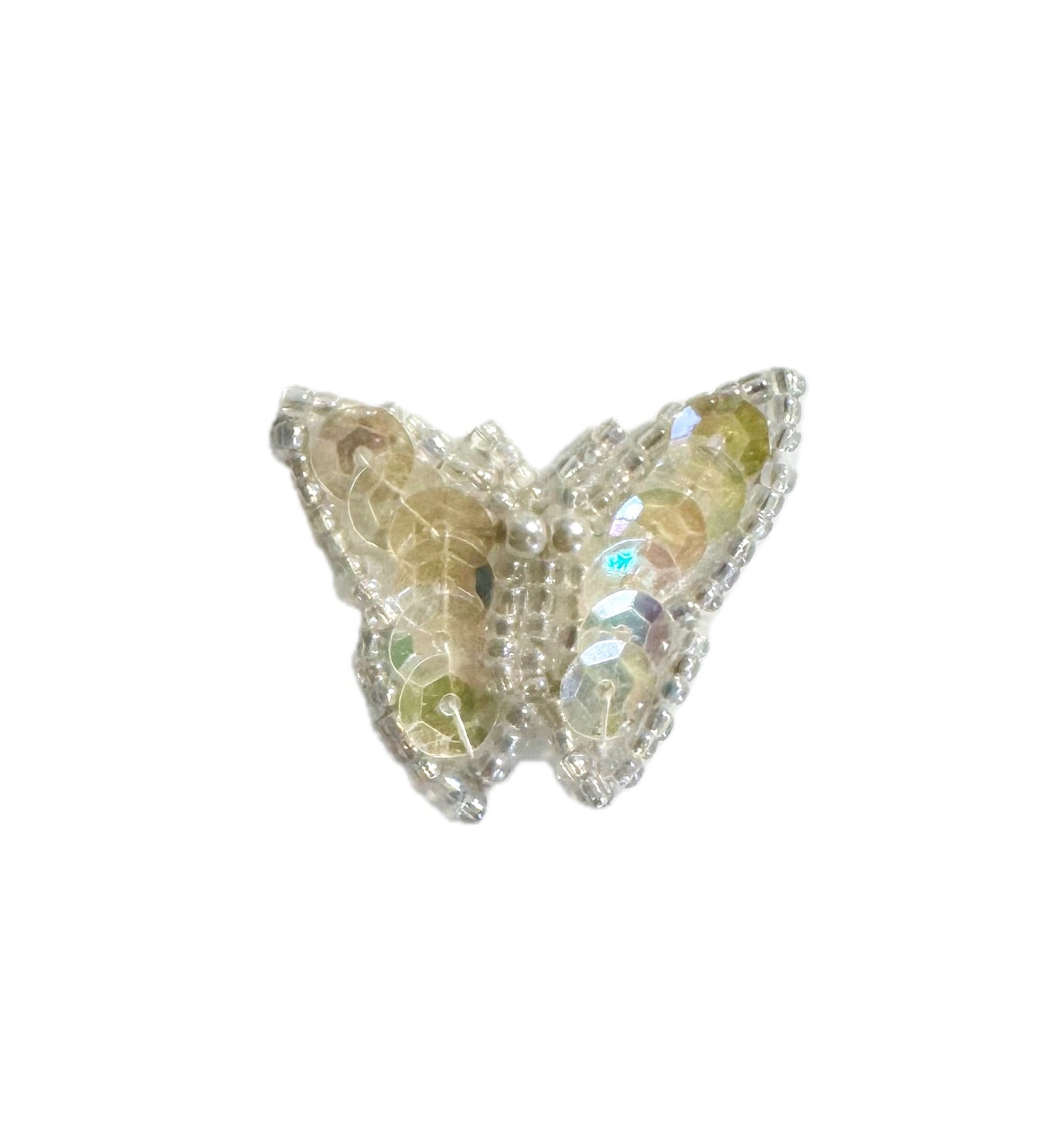 Butterfly-shaped patch with iridescent sequins and beads on a white background
