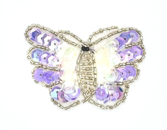 Butterfly-shaped decorative patch with purple and silver sequins design on a white background