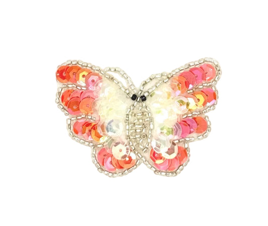 Butterfly-shaped dpatch with pink and orange sequins on a white background