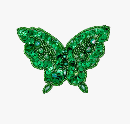 Green sequin butterfly patch on a white background