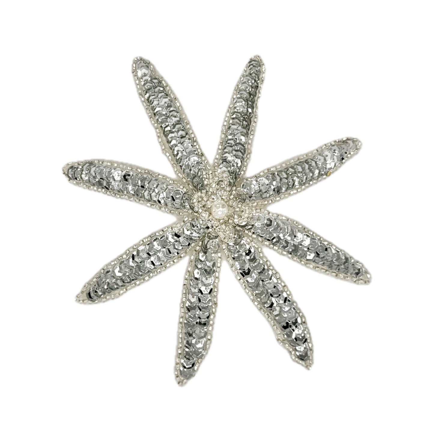 Silver sequin and bead flower on a white background
