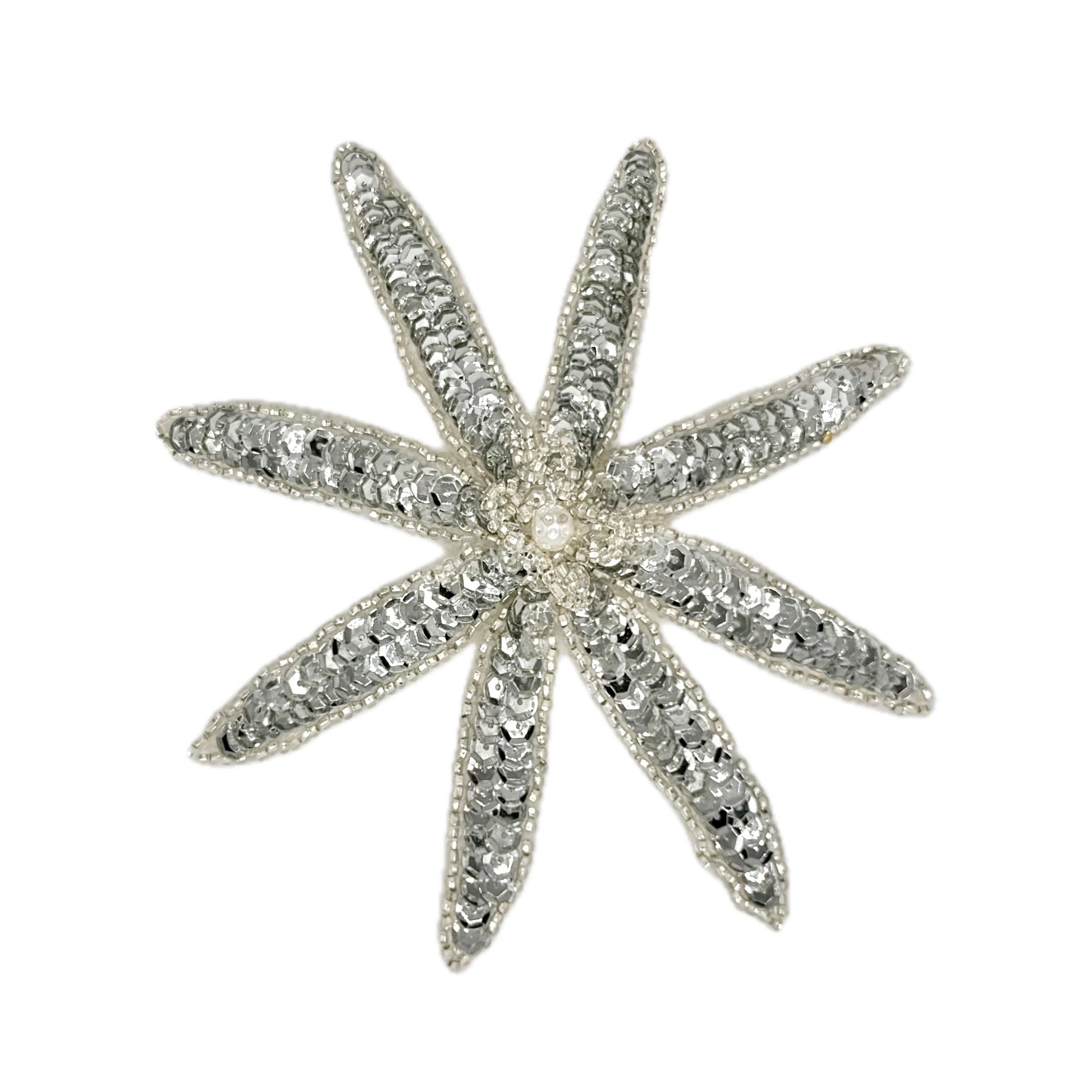 Silver sequin and bead flower on a white background