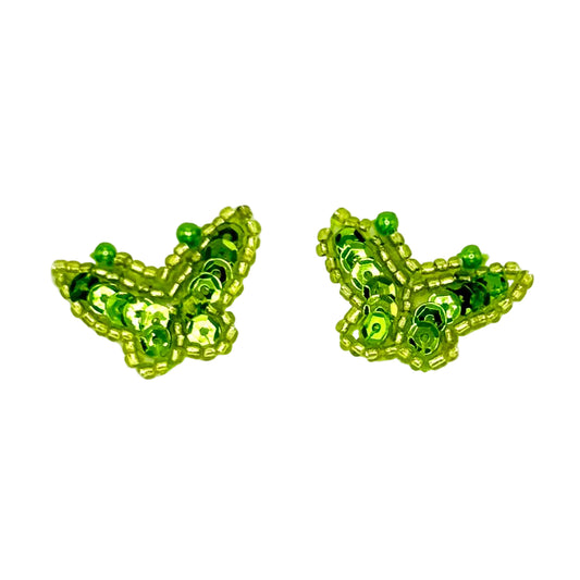 Pair of lime green butterfly-shaped sequin and bead patches on a white background