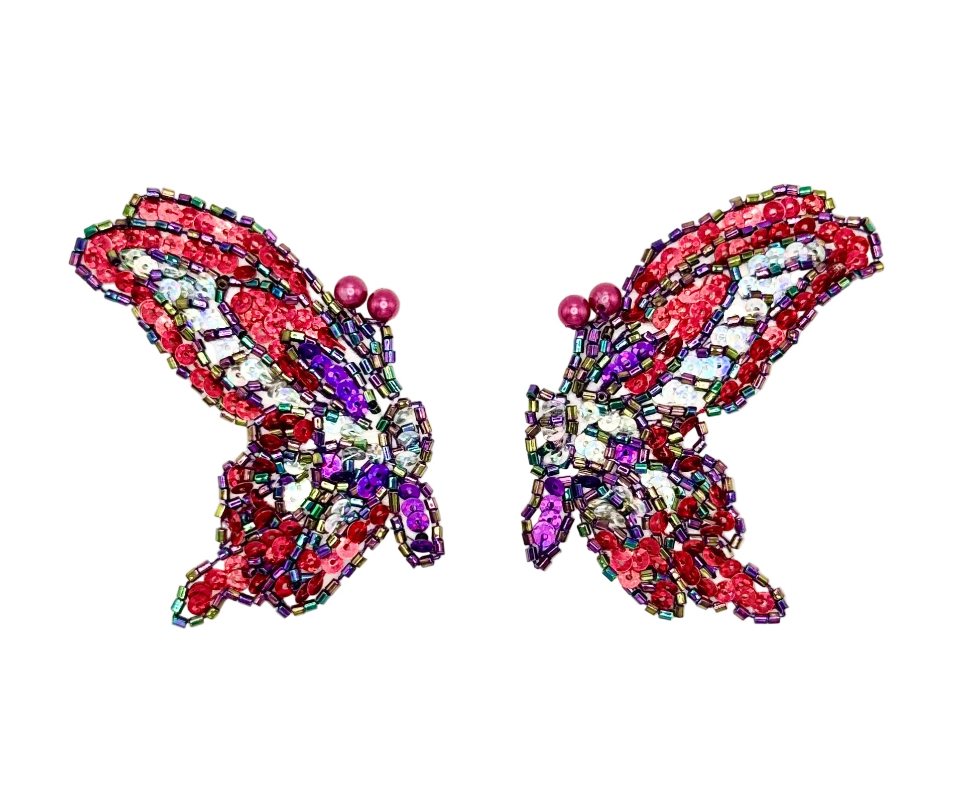 Butterfly-shaped sequin and bead pair on a white background