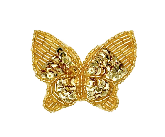 Gold sequin butterfly-shaped patch on a white background