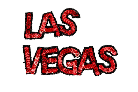 Red sequin 'LAS VEGAS' text on a white background