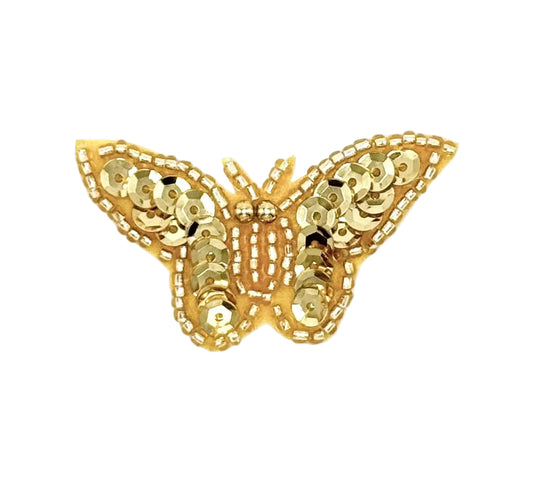 Gold butterfly-shaped patch with sequin details on a white background