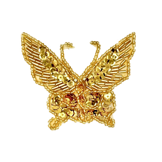 Gold butterfly-shaped sequin and bead patch on a white background
