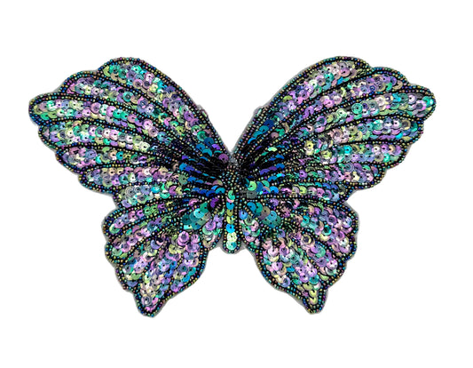 Multicolored butterfly-shaped decorative patch on a white background