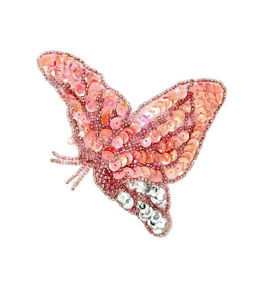 Iridescent Pink Sequined butterfly patch on a white background